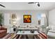 Comfortable living room with neutral palette, statement art, and stylish modern decor at 10501 Amberjack Way # 101, Englewood, FL 34224