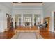 Spacious lobby featuring elegant wood flooring, ample seating, and bright natural light at 10501 Amberjack Way # 101, Englewood, FL 34224