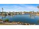 Scenic marina with boats docked on calm waters, showcasing waterfront living and boating access at 10501 Amberjack Way # 101, Englewood, FL 34224