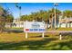 A sign indicates Palm Island Transit Inc. and a car ferry service, providing useful local information at 10501 Amberjack Way # 101, Englewood, FL 34224