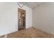 A storage unit with a caged door and shelving offers ample space for organizing belongings at 10501 Amberjack Way # 101, Englewood, FL 34224