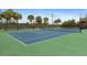 Community tennis courts with net and fenced in for safety and privacy at 10501 Amberjack Way # 101, Englewood, FL 34224