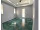 Bright bedroom with stained concrete floors and access to the outdoors at 1209 Nordendale Blvd, North Port, FL 34288