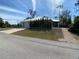 Modern house with metal roof, light gray accents, and walkway at 1209 Nordendale Blvd, North Port, FL 34288