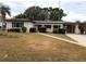 Single-story house with a carport and well-maintained lawn at 143 Francis Ne Dr, Port Charlotte, FL 33952