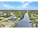 Aerial view showcasing a canal-front property with boat dock at 15133 Amsterdam, Port Charlotte, FL 33981