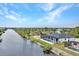 Aerial view of canal front home with pool at 15133 Amsterdam, Port Charlotte, FL 33981