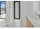 Bathroom with modern vanity and access to the patio at 15133 Amsterdam, Port Charlotte, FL 33981
