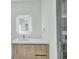 Modern bathroom vanity with a sleek countertop and illuminated mirror at 15133 Amsterdam, Port Charlotte, FL 33981