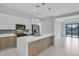 Modern kitchen with white cabinets, island, and stainless steel appliances at 15133 Amsterdam, Port Charlotte, FL 33981