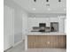 Modern kitchen with white cabinets, large island, and stainless steel appliances at 15133 Amsterdam, Port Charlotte, FL 33981