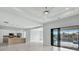 Open-concept living area with kitchen, island, and pool view at 15133 Amsterdam, Port Charlotte, FL 33981