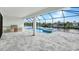 Inviting pool and spa with outdoor kitchen and canal views at 15133 Amsterdam, Port Charlotte, FL 33981