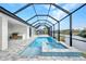 Enclosed pool and spa with outdoor kitchen and canal views at 15133 Amsterdam, Port Charlotte, FL 33981