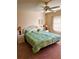 Spacious bedroom with king-size bed and ceiling fan at 175 Kings Hwy # Bldg 3 314, Punta Gorda, FL 33983