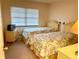 Guest bedroom with twin beds and wicker furniture at 175 Kings Hwy # Bldg 3 314, Punta Gorda, FL 33983