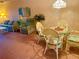 Casual dining area with wicker chairs and glass table at 175 Kings Hwy # Bldg 3 314, Punta Gorda, FL 33983