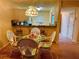 Charming condo dining area with wicker chairs and a glass-top table at 175 Kings Hwy # Bldg 3 314, Punta Gorda, FL 33983