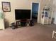 Living room with TV stand and wicker shelving at 175 Kings Hwy # Bldg 3 314, Punta Gorda, FL 33983