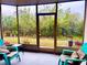 Peaceful screened porch with comfy seating overlooking a lush green landscape at 175 Kings Hwy # Bldg 3 314, Punta Gorda, FL 33983