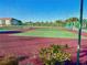 Two community tennis courts with red surface at 175 Kings Hwy # Bldg 3 314, Punta Gorda, FL 33983