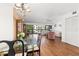 Spacious dining area with hardwood floors and a glass-top dining table at 1801 Jamaica Way # 112, Punta Gorda, FL 33950