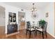 Charming dining area with a glass-top table and kitchen view at 1801 Jamaica Way # 112, Punta Gorda, FL 33950