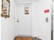 Building entryway with white door and elevator access at 1801 Jamaica Way # 112, Punta Gorda, FL 33950