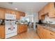 Well-equipped kitchen with light wood cabinets, granite counters, and modern appliances at 1801 Jamaica Way # 112, Punta Gorda, FL 33950