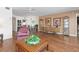 Open living area with hardwood floors and access to dining area at 1801 Jamaica Way # 112, Punta Gorda, FL 33950