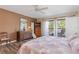 Main bedroom with king bed and access to a private balcony at 1801 Jamaica Way # 112, Punta Gorda, FL 33950