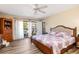King-size bed in main bedroom with private balcony access at 1801 Jamaica Way # 112, Punta Gorda, FL 33950