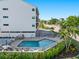 Relaxing pool area with patio furniture and landscaping at 1801 Jamaica Way # 112, Punta Gorda, FL 33950