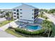 Inviting pool area with patio furniture and landscaping at 1801 Jamaica Way # 112, Punta Gorda, FL 33950