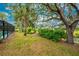 Expansive backyard with mature trees and canal view at 188 Broadmoor Ln, Rotonda West, FL 33947