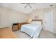 Cozy bedroom with a queen bed, dresser, and window at 188 Broadmoor Ln, Rotonda West, FL 33947