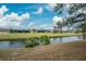 Scenic view of canal with lush landscaping and homes at 188 Broadmoor Ln, Rotonda West, FL 33947