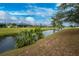 Peaceful canal view with lush greenery and homes at 188 Broadmoor Ln, Rotonda West, FL 33947