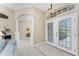 Bright and spacious entryway with tiled flooring and access to living room at 188 Broadmoor Ln, Rotonda West, FL 33947