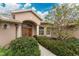 Inviting entryway with double doors and lush landscaping at 188 Broadmoor Ln, Rotonda West, FL 33947
