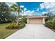Single-story home with attached garage and manicured lawn at 188 Broadmoor Ln, Rotonda West, FL 33947
