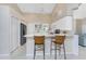 Kitchen with breakfast bar and stainless steel appliances at 188 Broadmoor Ln, Rotonda West, FL 33947