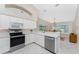 Kitchen boasts stainless steel appliances and ample counter space at 188 Broadmoor Ln, Rotonda West, FL 33947