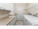 Laundry room with washer, dryer, cabinets and counter space at 188 Broadmoor Ln, Rotonda West, FL 33947