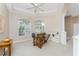Home office with built-in shelving and large windows at 188 Broadmoor Ln, Rotonda West, FL 33947