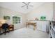 Home office with built-in shelving and a large window at 188 Broadmoor Ln, Rotonda West, FL 33947