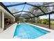 Inviting refreshing pool with a screened enclosure at 188 Broadmoor Ln, Rotonda West, FL 33947