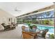 Relaxing pool area with wicker furniture and screened enclosure at 188 Broadmoor Ln, Rotonda West, FL 33947