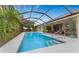 Relaxing screened-in pool with surrounding patio at 188 Broadmoor Ln, Rotonda West, FL 33947