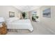 Large Primary bedroom with sliding door to lanai and pool at 188 Broadmoor Ln, Rotonda West, FL 33947